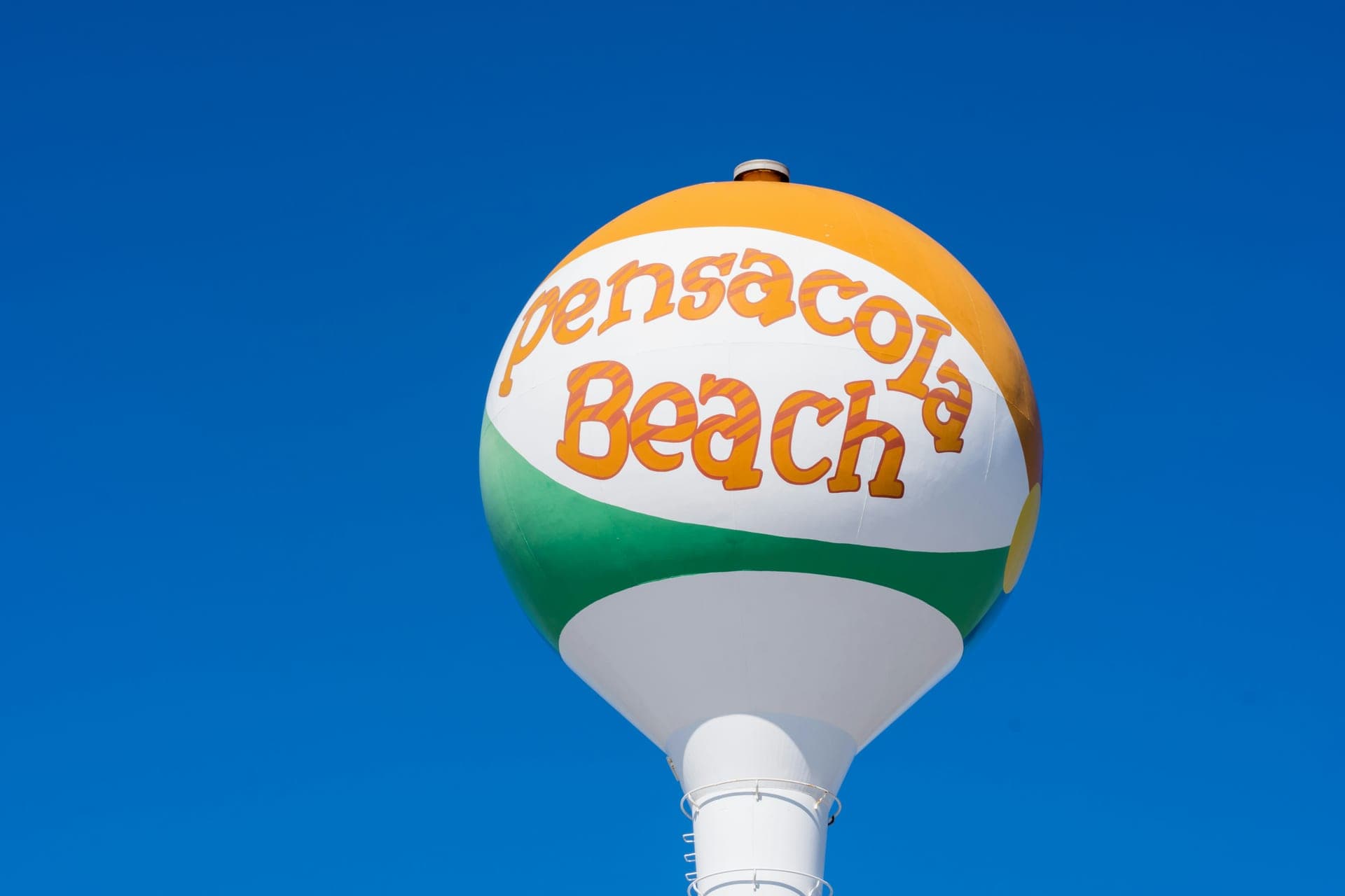 The iconic Pensacola Beach water tower painted like a beach ball, a landmark on Santa Rosa Island.